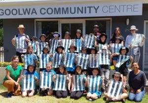 group children in front of goolwa community centre posing with craft projects